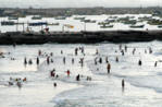 photos of palestinians swimming in Gaza City